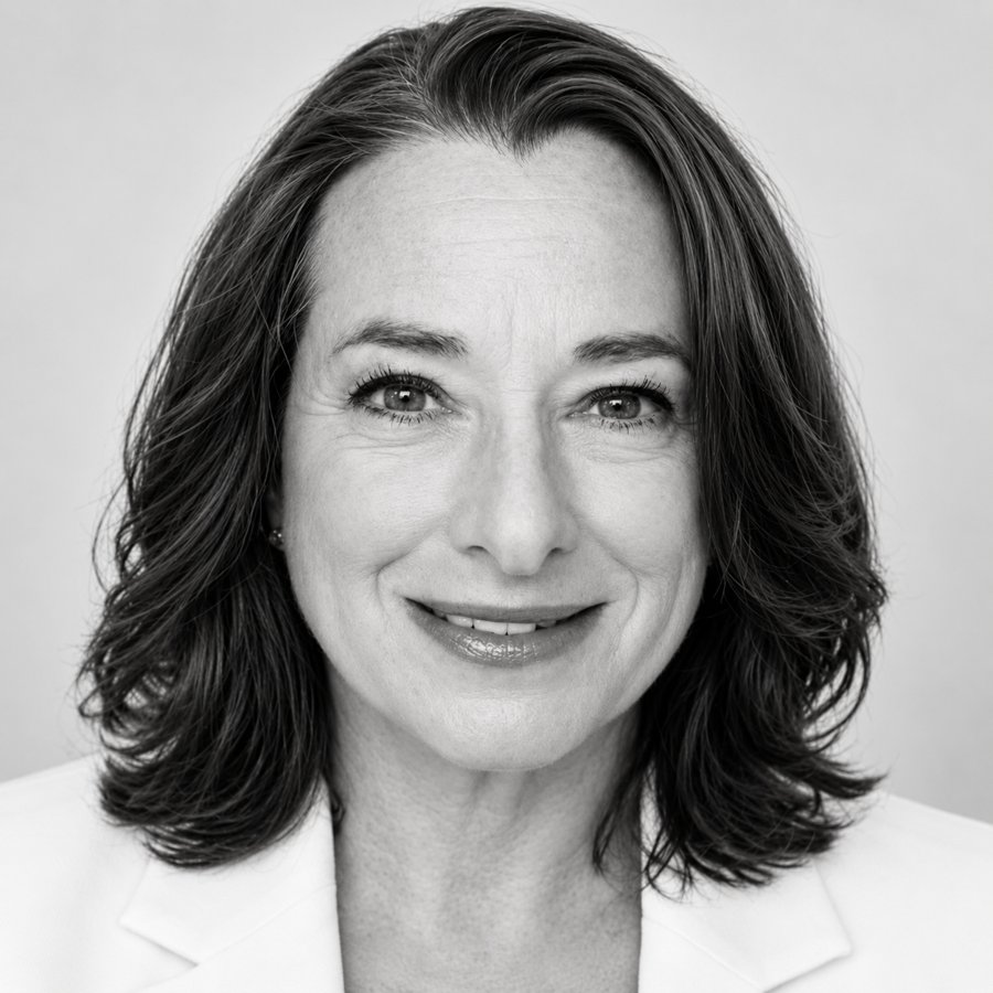 Black-and-white studio portrait of Anna Conrad, CEO of Impact Leadership Solutions