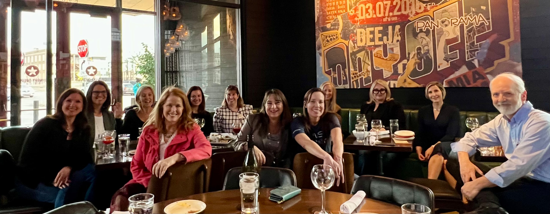 Roundtable members sharing a group dinner at a restaurant
