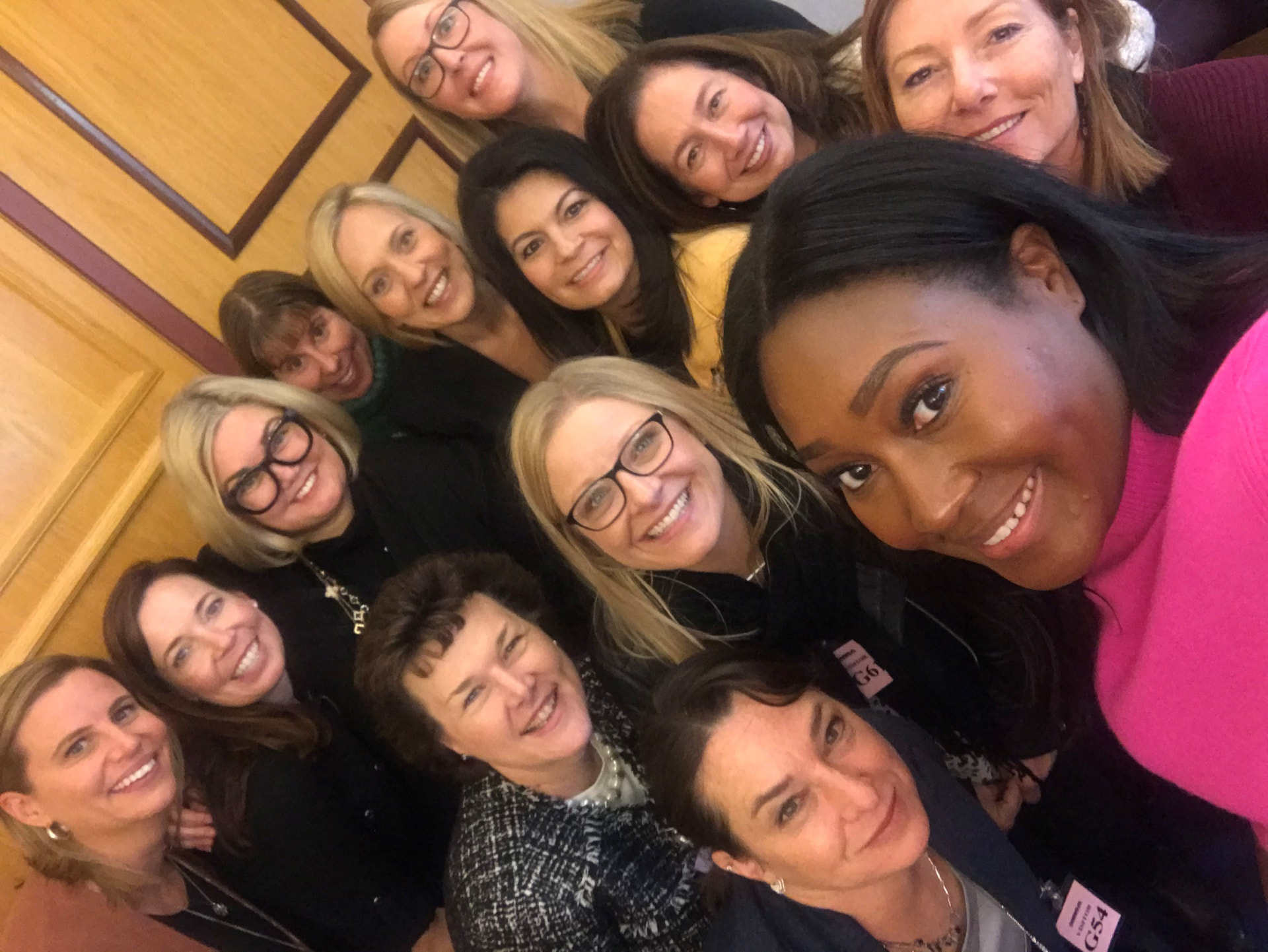 Roundtable members taking a lighthearted group selfie at a gathering