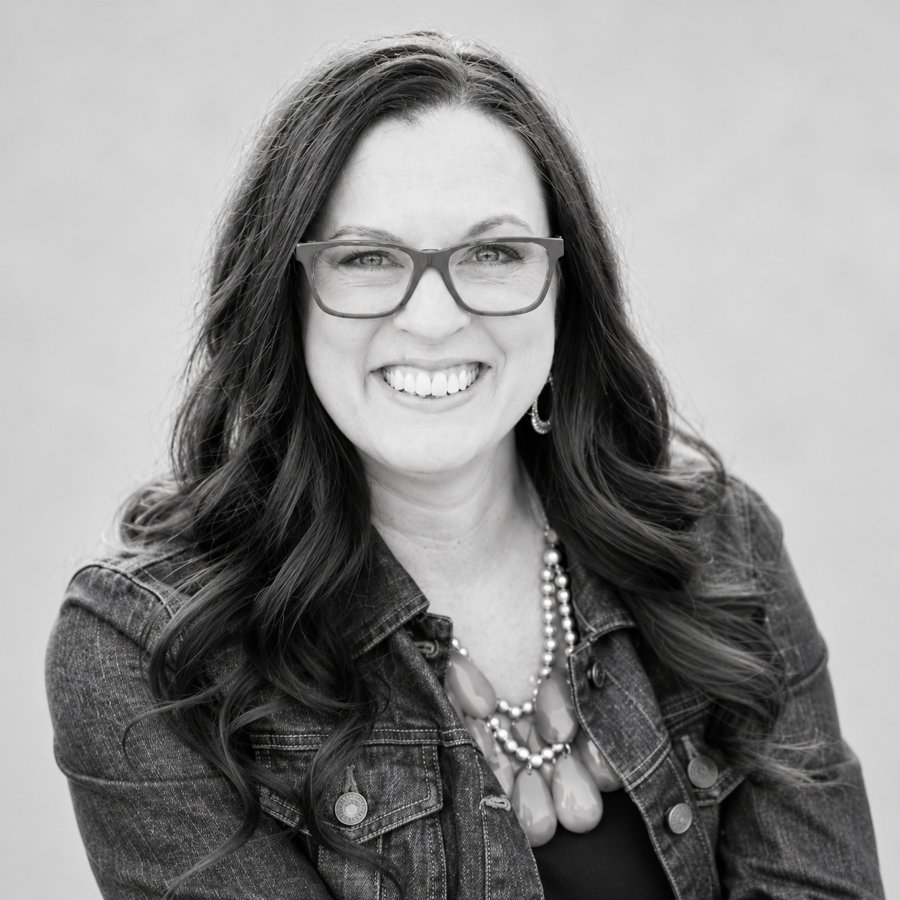 Black-and-white studio portrait of Heather Bokon, who keeps operations running at Impact Leadership Solutions